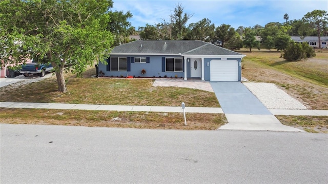3342 Avanti Cir, North Port, FL 34287 - ranch-style home featuring an attached garage, driveway, a front lawn, and stucco siding
