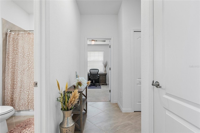 17620 Winding Wood Ln, Punta Gorda, FL 33982 - corridor featuring light tile patterned floors and baseboards