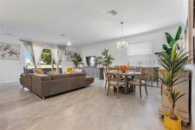 17620 Winding Wood Ln, Punta Gorda, FL 33982 - living room with ornamental molding, light tile patterned flooring, and a chandelier