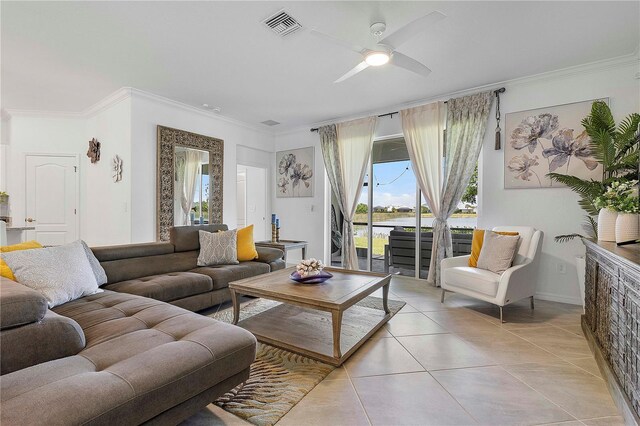 17620 Winding Wood Ln, Punta Gorda, FL 33982 - living area with ornamental molding, light tile patterned flooring, a ceiling fan, and healthy amount of natural light