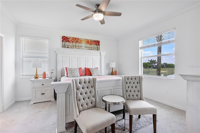 17620 Winding Wood Ln, Punta Gorda, FL 33982 - bedroom featuring light colored carpet, crown molding, baseboards, and a ceiling fan