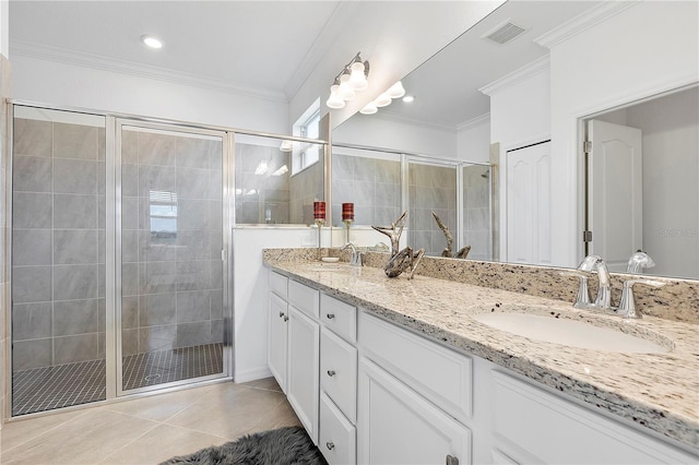 17620 Winding Wood Ln, Punta Gorda, FL 33982 - bathroom featuring a shower stall, crown molding, double vanity, and tile patterned flooring