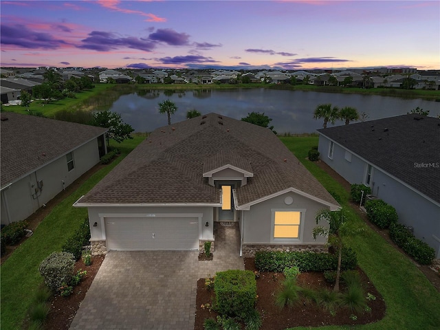 17620 Winding Wood Ln, Punta Gorda, FL 33982 - ranch-style home featuring stucco siding, stone siding, and a garage