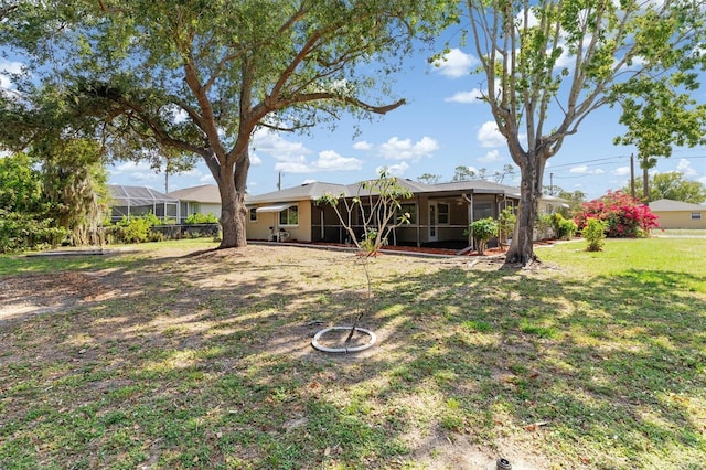 485 Dorchester St, Port Charlotte, FL 33954 - view of green lawn featuring a sunroom