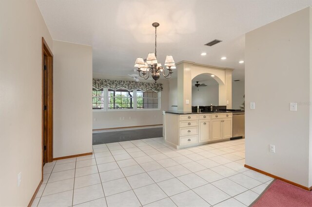 485 Dorchester St, Port Charlotte, FL 33954 - kitchen featuring cream cabinetry, a chandelier, dark countertops, baseboards, and pendant lighting