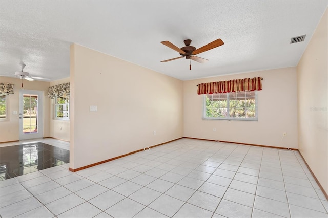 485 Dorchester St, Port Charlotte, FL 33954 - unfurnished room featuring a textured ceiling, ceiling fan, plenty of natural light, and baseboards