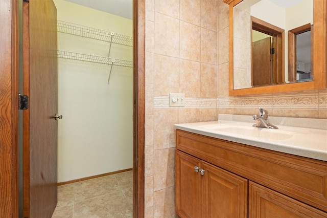 485 Dorchester St, Port Charlotte, FL 33954 - bathroom with vanity, baseboards, and tile patterned flooring