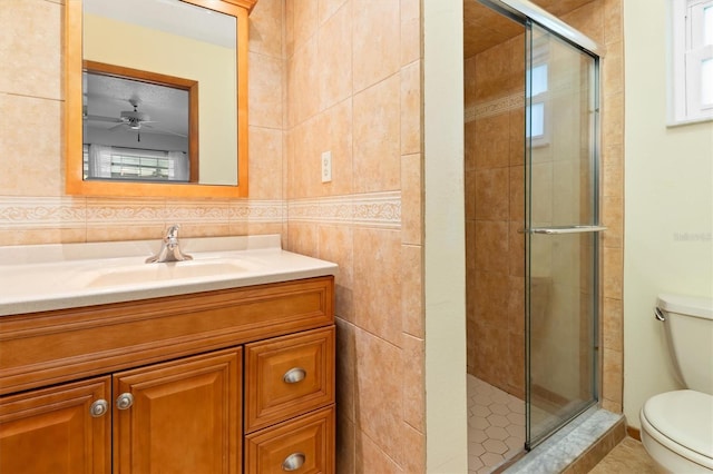 485 Dorchester St, Port Charlotte, FL 33954 - full bathroom featuring toilet, a shower stall, vanity, a ceiling fan, and tile walls