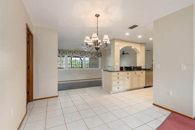 485 Dorchester St, Port Charlotte, FL 33954 - kitchen with cream cabinets, a chandelier, dark countertops, pendant lighting, and open floor plan