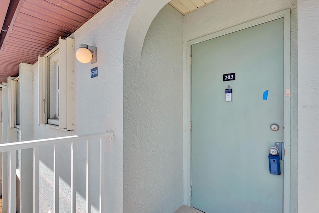 25100 Sandhill Blvd Unit F-203, Punta Gorda, FL 33983 - property entrance with stucco siding