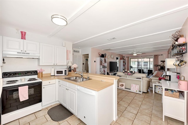 25100 Sandhill Blvd Unit F-203, Punta Gorda, FL 33983 - kitchen with white appliances, under cabinet range hood, a sink, a peninsula, and light tile patterned flooring