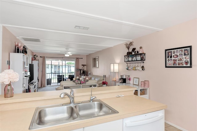 25100 Sandhill Blvd Unit F-203, Punta Gorda, FL 33983 - kitchen featuring a sink, light countertops, open floor plan, a ceiling fan, and white dishwasher
