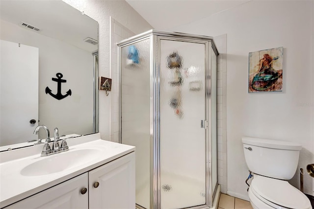 25100 Sandhill Blvd Unit F-203, Punta Gorda, FL 33983 - bathroom featuring a stall shower, toilet, vanity, and tile patterned flooring