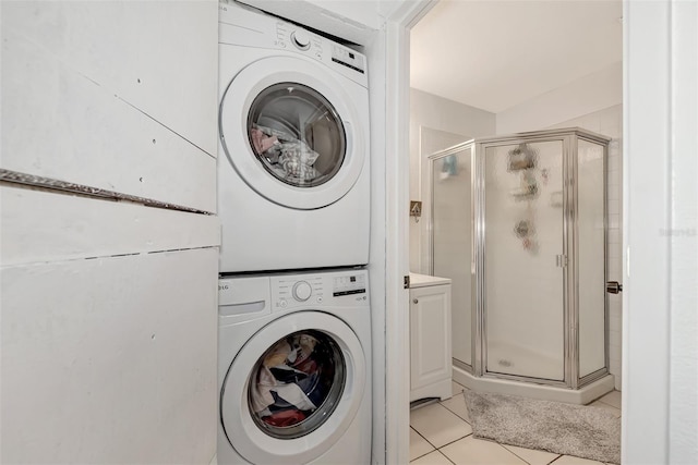 25100 Sandhill Blvd Unit F-203, Punta Gorda, FL 33983 - clothes washing area with stacked washer / drying machine and light tile patterned floors