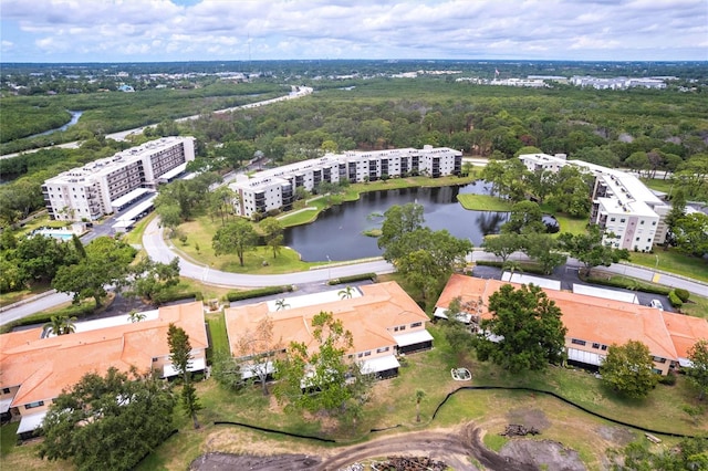 aerial view of apartment complex and a large body of water
