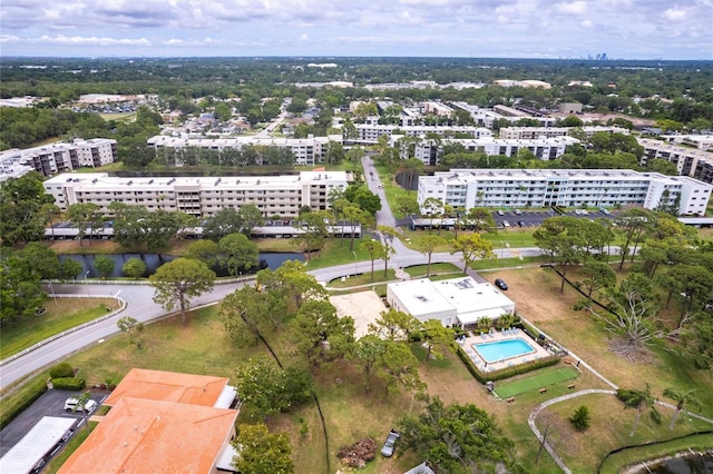 view of urban area with apartment complex / building and a pool