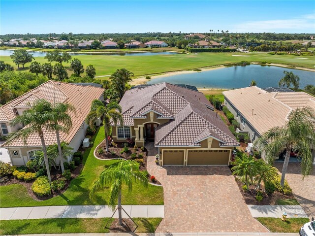 5461 White Ibis Dr, North Port, FL 34287 - aerial view of residential area featuring a golf club and a large body of water