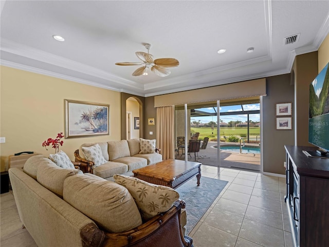 5461 White Ibis Dr, North Port, FL 34287 - living area featuring arched walkways, light tile patterned flooring, ceiling fan, ornamental molding, and recessed lighting