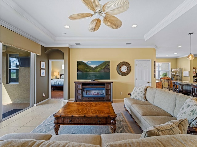 5461 White Ibis Dr, North Port, FL 34287 - living room with light tile patterned floors, ornamental molding, baseboards, a tray ceiling, and recessed lighting