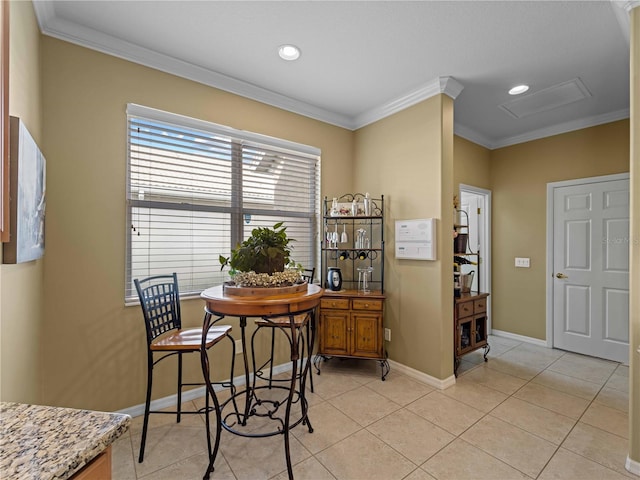 5461 White Ibis Dr, North Port, FL 34287 - dining space featuring ornamental molding, attic access, light tile patterned floors, baseboards, and recessed lighting
