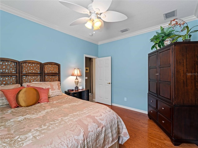 5461 White Ibis Dr, North Port, FL 34287 - bedroom featuring wood finished floors, crown molding, baseboards, and a ceiling fan