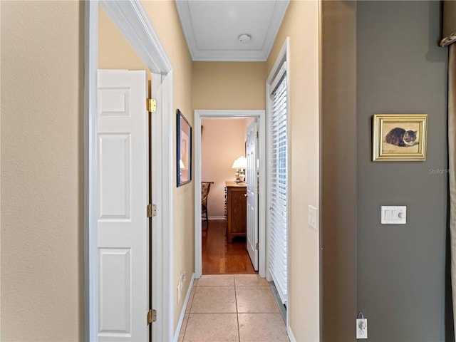 5461 White Ibis Dr, North Port, FL 34287 - hall with ornamental molding, light tile patterned floors, and baseboards