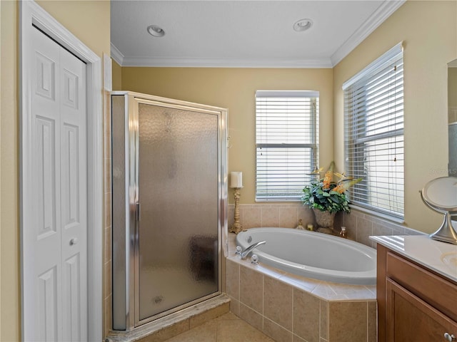 5461 White Ibis Dr, North Port, FL 34287 - full bathroom with vanity, a garden tub, a shower stall, ornamental molding, and a closet