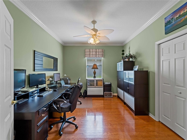 5461 White Ibis Dr, North Port, FL 34287 - home office featuring crown molding, a ceiling fan, wood finished floors, baseboards, and a textured ceiling