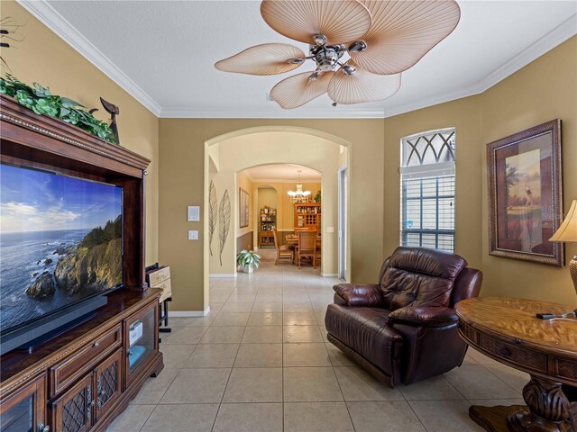 5461 White Ibis Dr, North Port, FL 34287 - living room featuring arched walkways, light tile patterned floors, crown molding, a chandelier, and baseboards