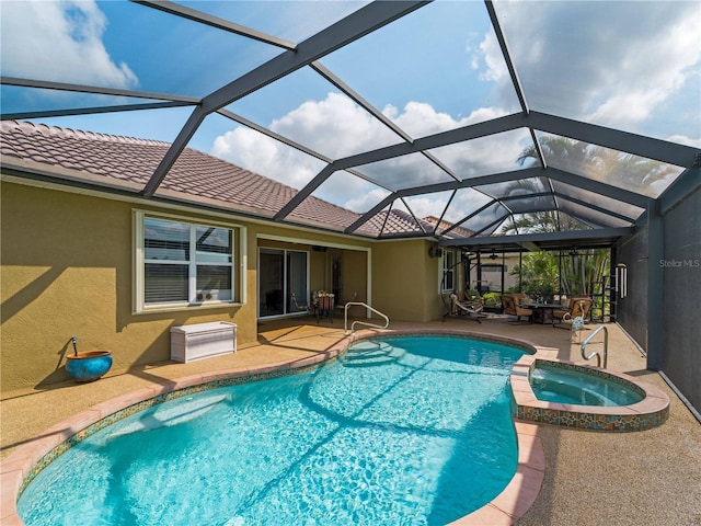 5461 White Ibis Dr, North Port, FL 34287 - view of swimming pool featuring a patio, a pool with connected hot tub, and glass enclosure