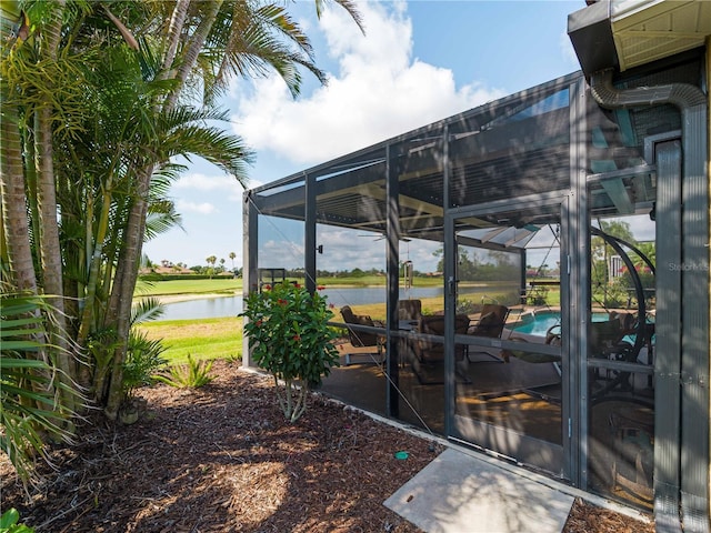 5461 White Ibis Dr, North Port, FL 34287 - view of yard featuring a water view, an outdoor pool, glass enclosure, and a patio area