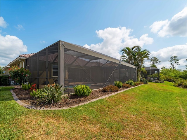 5461 White Ibis Dr, North Port, FL 34287 - view of grassy yard with a lanai