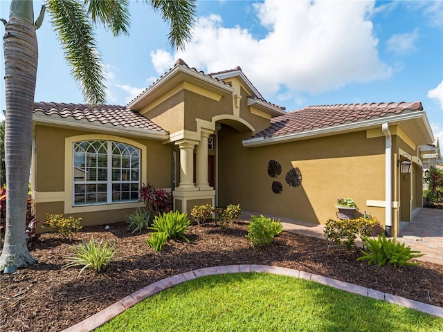 5461 White Ibis Dr, North Port, FL 34287 - mediterranean / spanish-style home with stucco siding and a tile roof