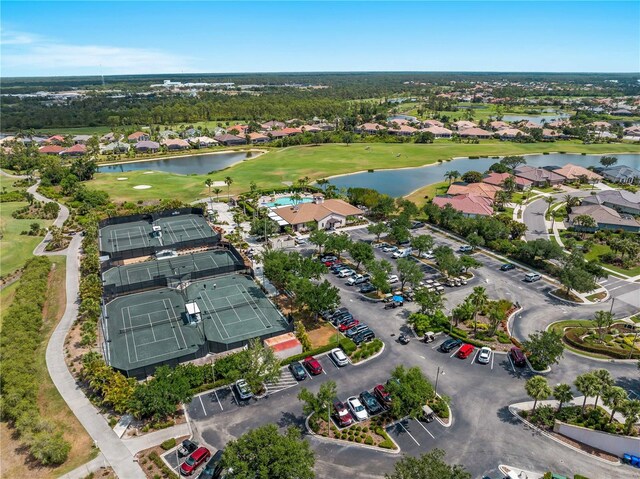 5461 White Ibis Dr, North Port, FL 34287 - aerial overview of property's location with a large body of water, a local golf course, and nearby suburban area