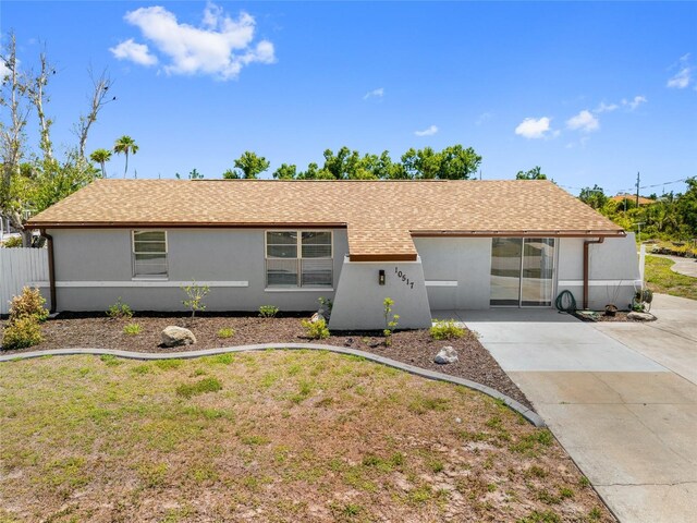 10517 Greenway Ave, Englewood, FL 34224 - ranch-style house with stucco siding and driveway