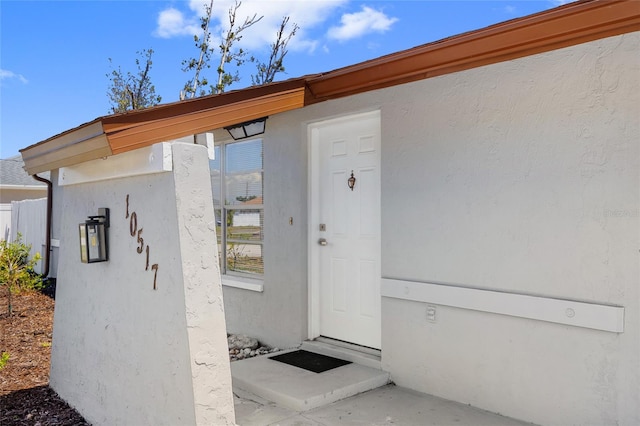 10517 Greenway Ave, Englewood, FL 34224 - property entrance featuring stucco siding