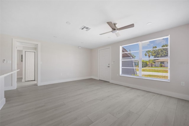 10517 Greenway Ave, Englewood, FL 34224 - unfurnished room featuring light wood finished floors, ceiling fan, and baseboards