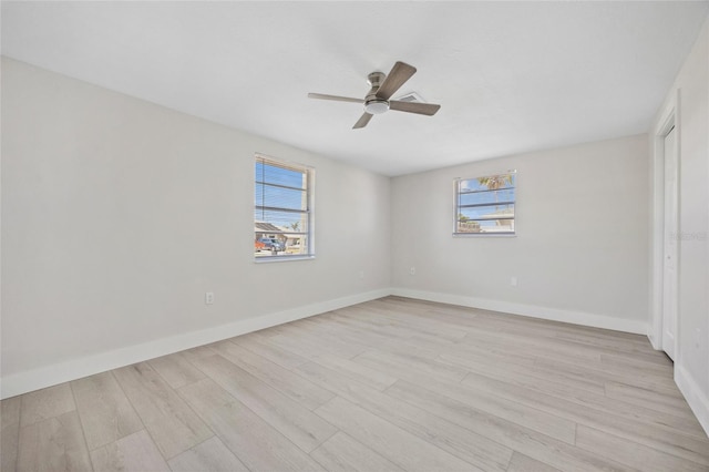 10517 Greenway Ave, Englewood, FL 34224 - unfurnished bedroom featuring light wood finished floors, baseboards, a ceiling fan, and a closet
