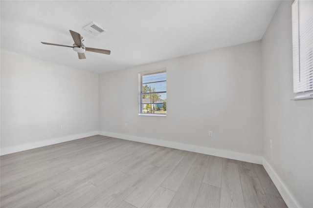 10517 Greenway Ave, Englewood, FL 34224 - spare room with light wood-style flooring, a ceiling fan, and baseboards