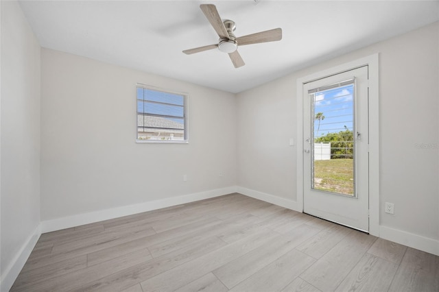 10517 Greenway Ave, Englewood, FL 34224 - spare room featuring wood finished floors, baseboards, and ceiling fan