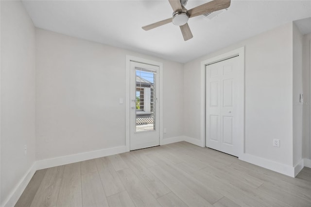 10517 Greenway Ave, Englewood, FL 34224 - unfurnished bedroom with light wood-type flooring, baseboards, and a ceiling fan