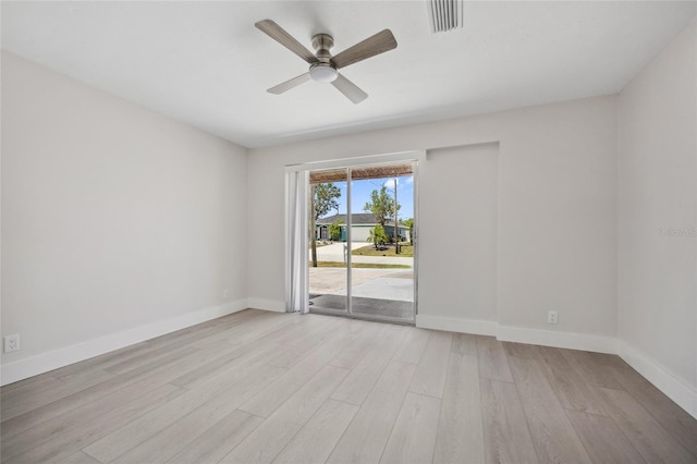 10517 Greenway Ave, Englewood, FL 34224 - empty room featuring light wood-style flooring, baseboards, and ceiling fan