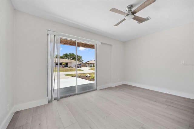 10517 Greenway Ave, Englewood, FL 34224 - spare room with light wood-style floors, ceiling fan, and baseboards
