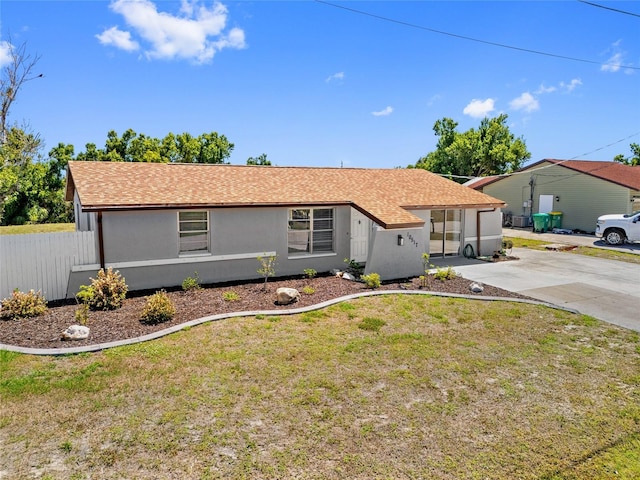 10517 Greenway Ave, Englewood, FL 34224 - ranch-style home with stucco siding and concrete driveway