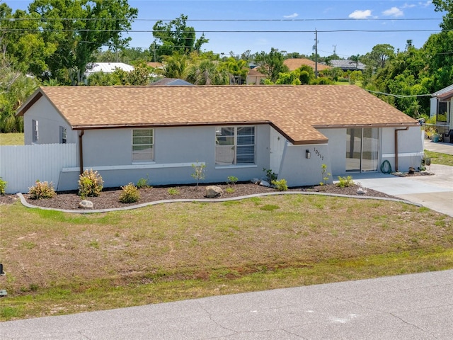 10517 Greenway Ave, Englewood, FL 34224 - single story home featuring a shingled roof and stucco siding