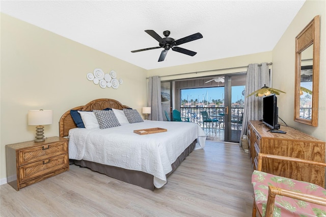 3160 Matecumbe Key Rd Unit 238, Punta Gorda, FL 33955 - bedroom featuring access to exterior, wood finished floors, and a ceiling fan