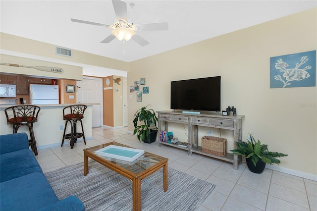 3160 Matecumbe Key Rd Unit 238, Punta Gorda, FL 33955 - living area featuring light tile patterned floors, ceiling fan, and baseboards