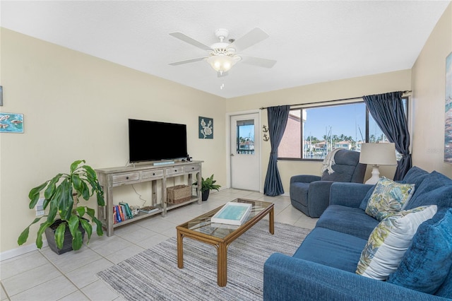 3160 Matecumbe Key Rd Unit 238, Punta Gorda, FL 33955 - living area featuring tile patterned flooring, ceiling fan, and baseboards