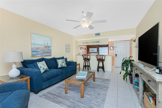 3160 Matecumbe Key Rd Unit 238, Punta Gorda, FL 33955 - living area with light tile patterned flooring, ceiling fan, and a textured ceiling