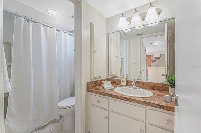 3160 Matecumbe Key Rd Unit 238, Punta Gorda, FL 33955 - bathroom with toilet, tile patterned flooring, and vanity